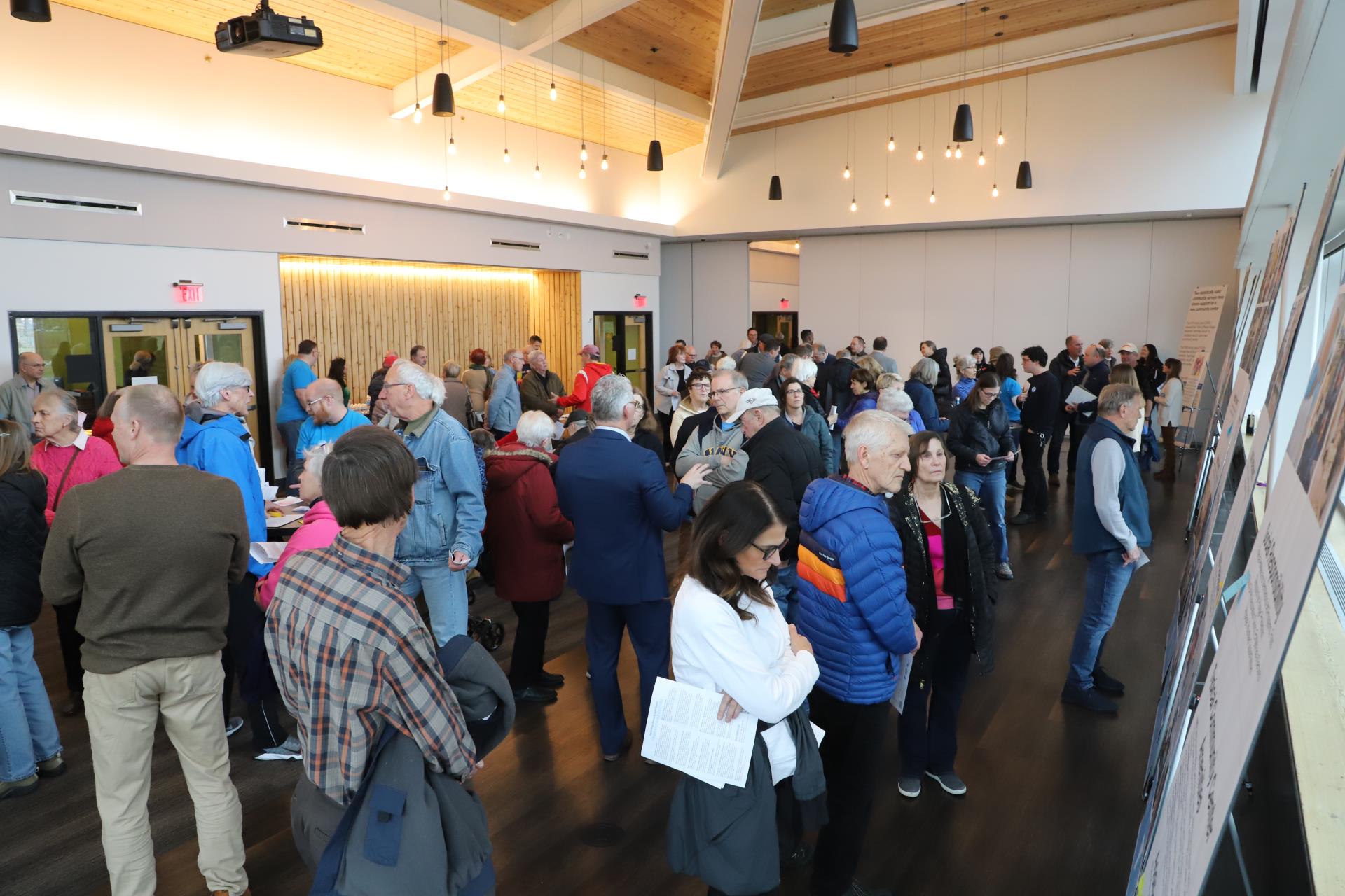 Image of people attending a public meeting on a potential community center campus